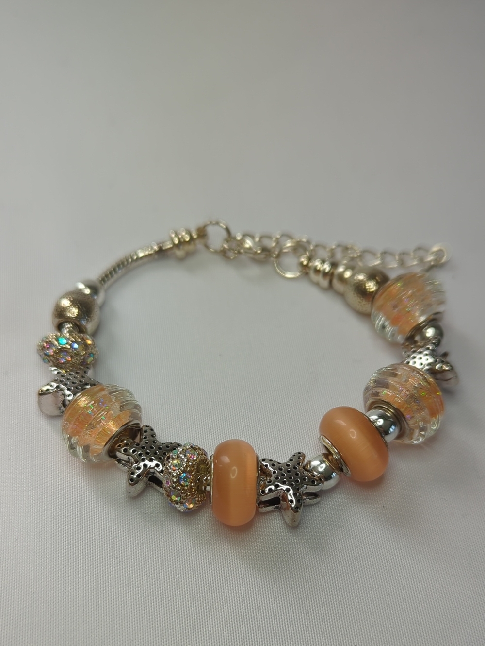 Sterling Plated Charm Bracelet with Peach Glass Beads